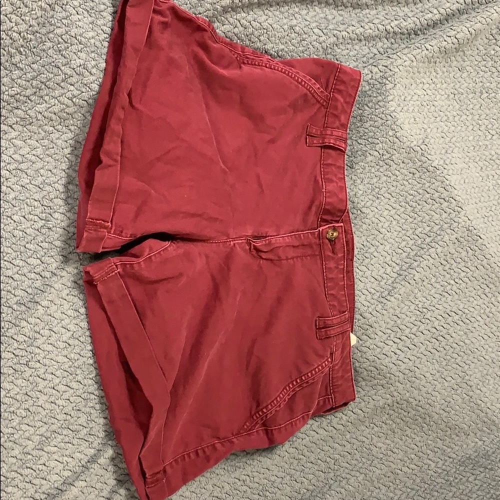 Maroon shorts.